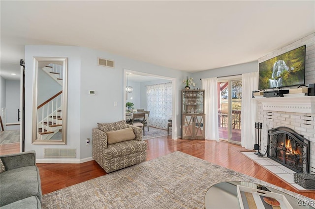 living room featuring hardwood / wood-style floors and a fireplace