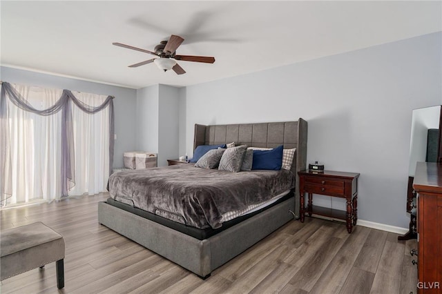 bedroom featuring wood-type flooring and ceiling fan