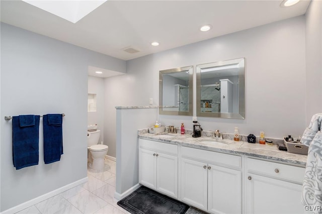 bathroom with toilet, a shower, and vanity