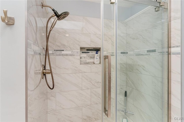 bathroom featuring an enclosed shower