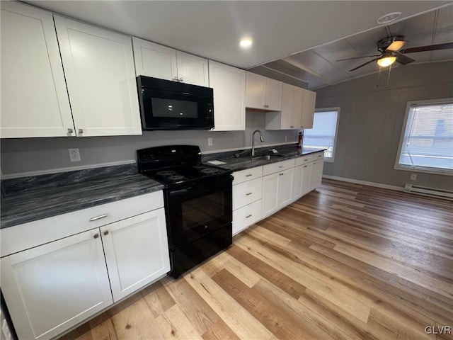 kitchen with ceiling fan, black appliances, sink, light wood-type flooring, and white cabinets