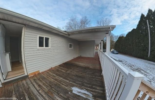 view of snow covered deck