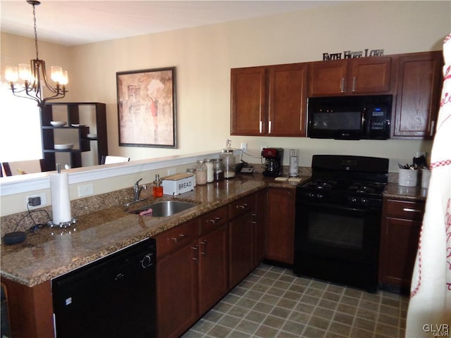 kitchen with black appliances, decorative light fixtures, an inviting chandelier, sink, and stone countertops