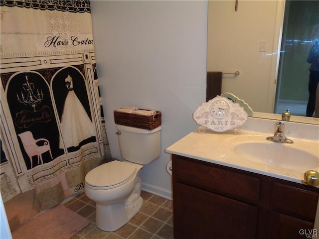 bathroom with toilet and vanity