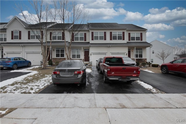 townhome / multi-family property featuring a garage