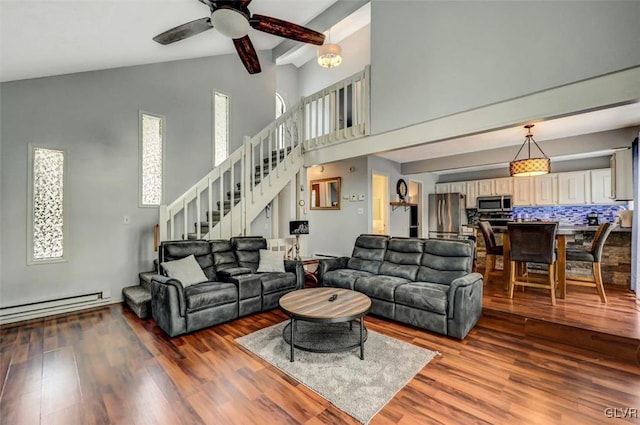 living room featuring wood-type flooring, a baseboard heating unit, beamed ceiling, high vaulted ceiling, and ceiling fan