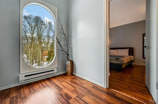 interior space featuring dark hardwood / wood-style floors and a baseboard radiator