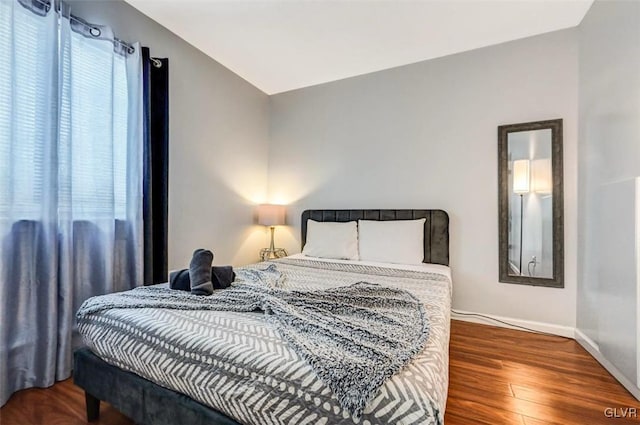 bedroom featuring dark hardwood / wood-style floors