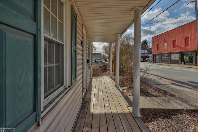 wooden terrace with a porch