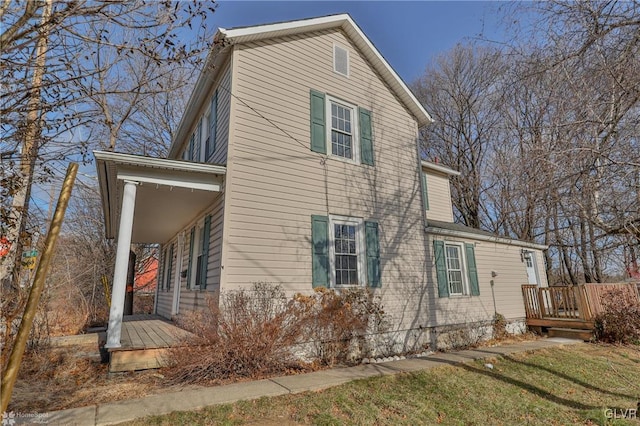 view of side of home featuring a deck