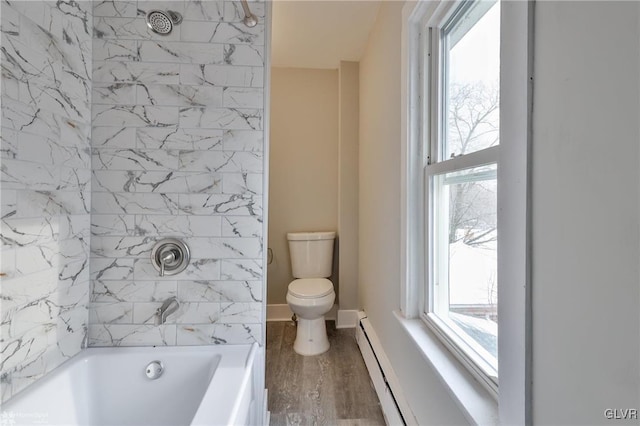 bathroom with a baseboard radiator, hardwood / wood-style floors, toilet, and a wealth of natural light