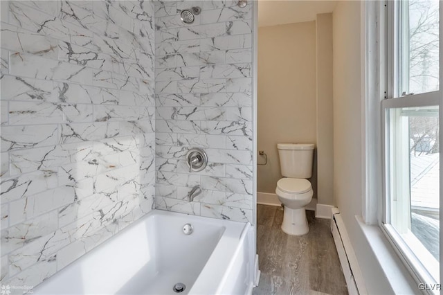 bathroom with toilet, a baseboard heating unit, and hardwood / wood-style floors