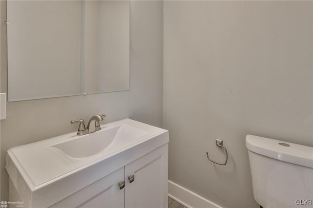 bathroom with toilet and vanity