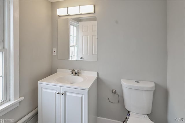 bathroom featuring toilet and vanity