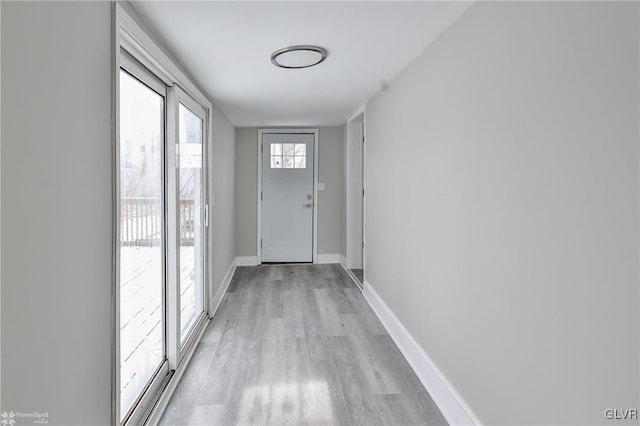 doorway to outside with light hardwood / wood-style floors