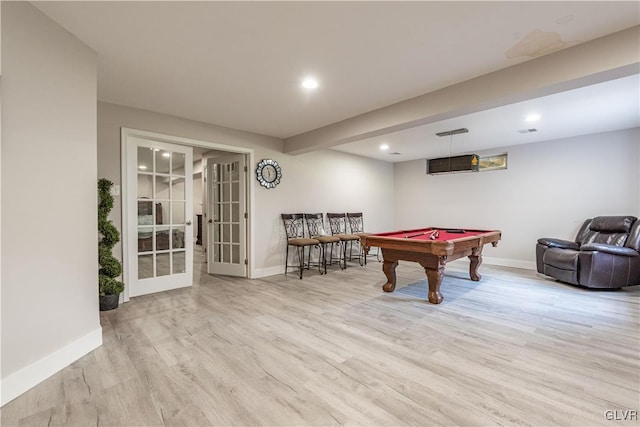 recreation room featuring billiards, french doors, and light wood-type flooring