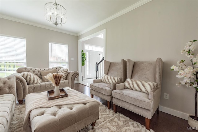 living room featuring dark hardwood / wood-style flooring, crown molding, and a notable chandelier