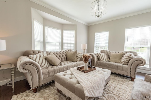 living room featuring hardwood / wood-style flooring, crown molding, and a chandelier