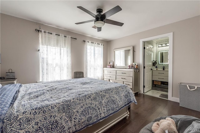 bedroom with ceiling fan, connected bathroom, and dark hardwood / wood-style floors