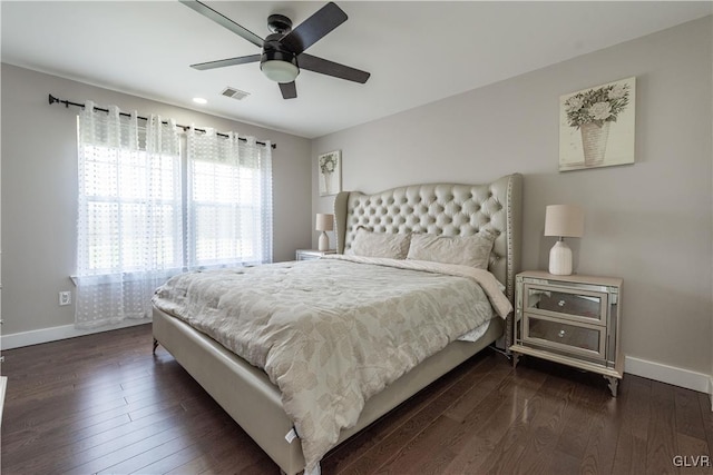 bedroom featuring ceiling fan and dark wood-type flooring