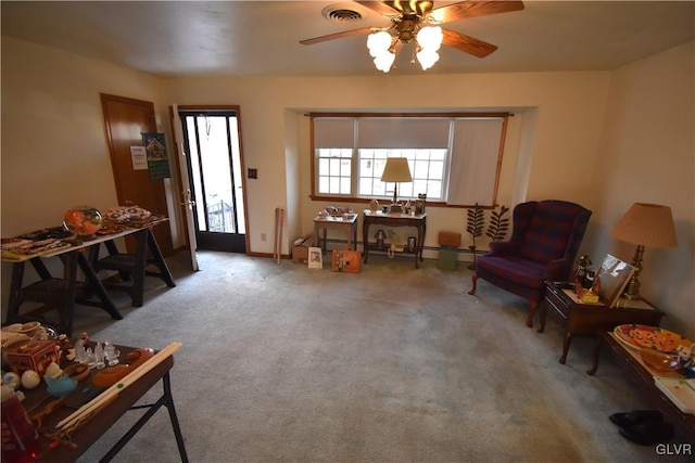 interior space with ceiling fan