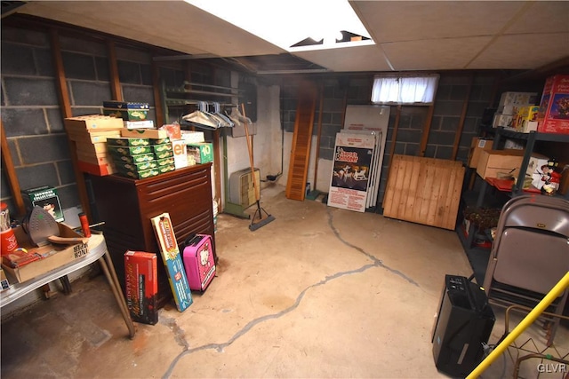 basement featuring a paneled ceiling