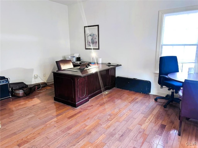 office space with light hardwood / wood-style floors