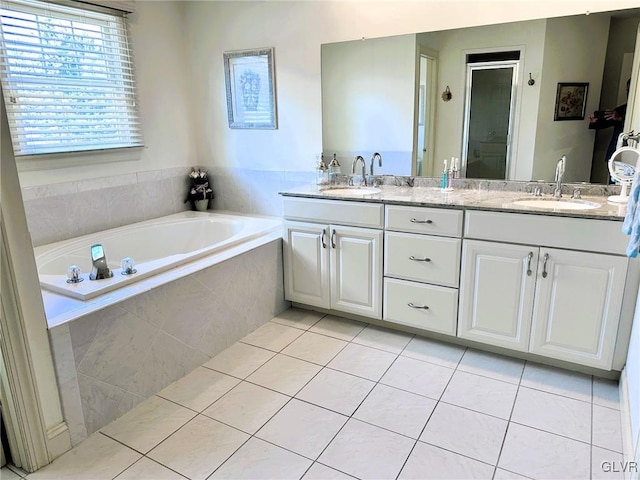 bathroom featuring tile patterned floors, vanity, and plus walk in shower