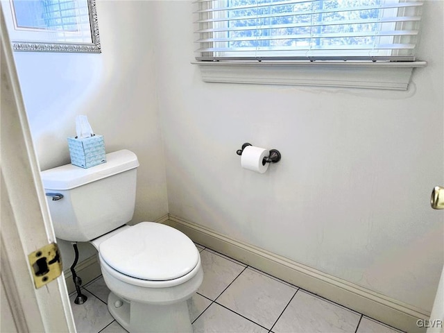 bathroom featuring tile patterned floors and toilet