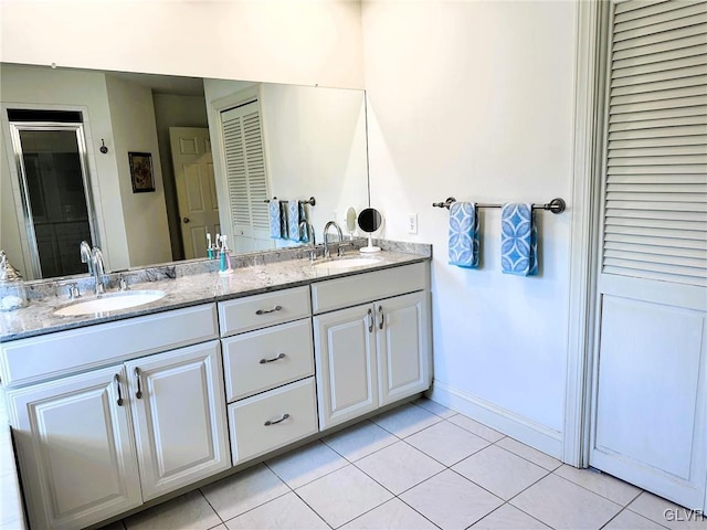 bathroom featuring vanity and tile patterned flooring