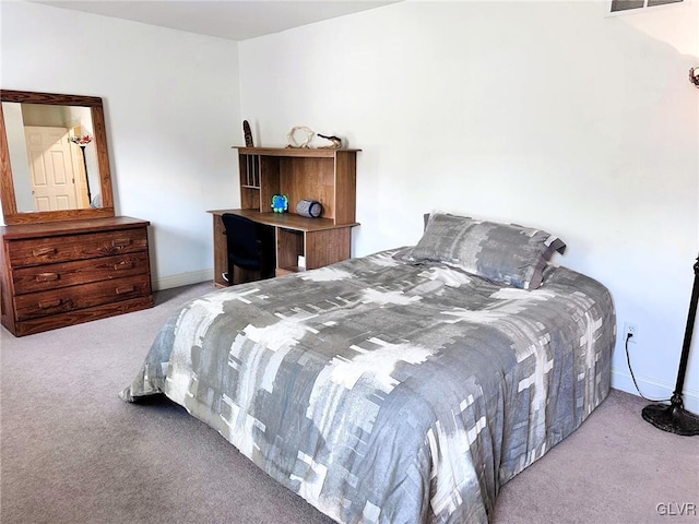 bedroom with light colored carpet