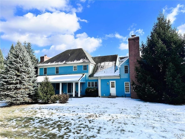 view of snow covered house