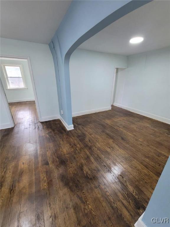 empty room featuring dark hardwood / wood-style floors