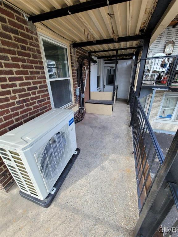 view of patio / terrace featuring ac unit