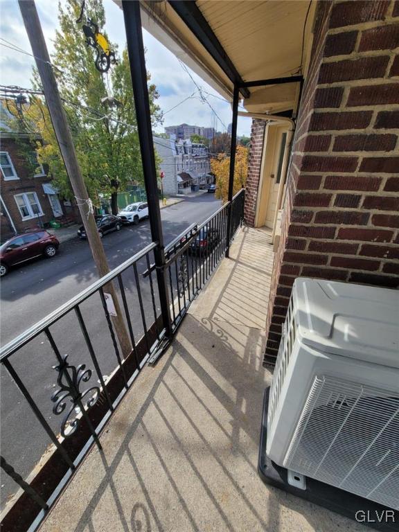 balcony featuring ac unit