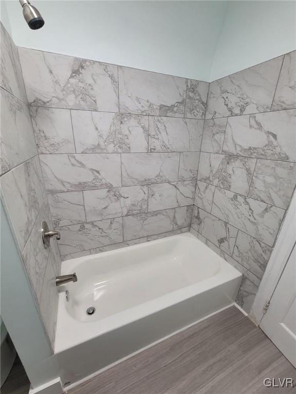 bathroom featuring shower / bath combination and hardwood / wood-style floors