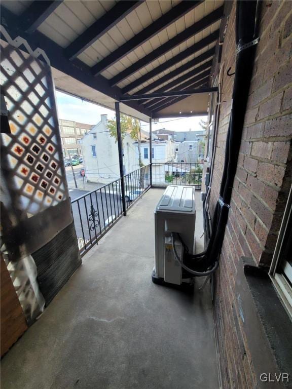 view of patio featuring a balcony