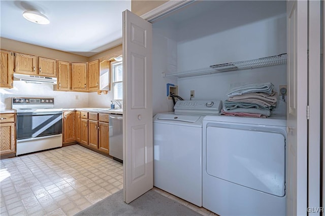 laundry room featuring independent washer and dryer and sink