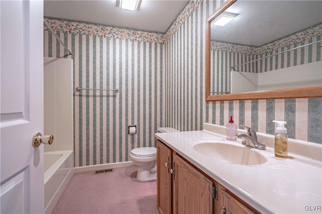 full bathroom featuring toilet, bathing tub / shower combination, and vanity