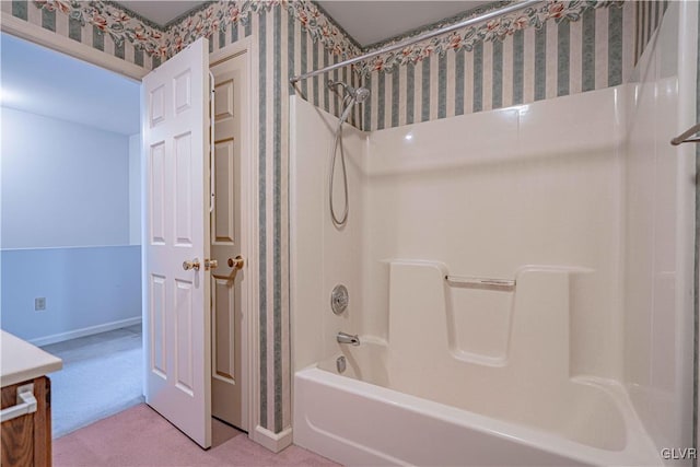 bathroom with vanity and bathtub / shower combination