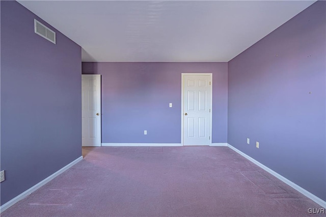 unfurnished room featuring carpet flooring