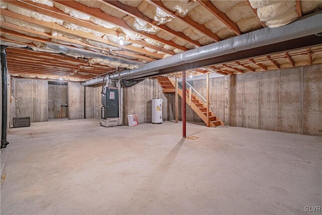 basement with water heater and heating unit