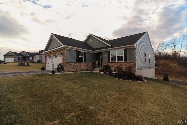 view of front of home featuring a garage and a front lawn