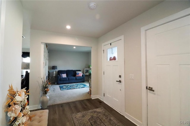 entrance foyer with dark hardwood / wood-style floors