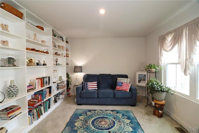 living area with light carpet