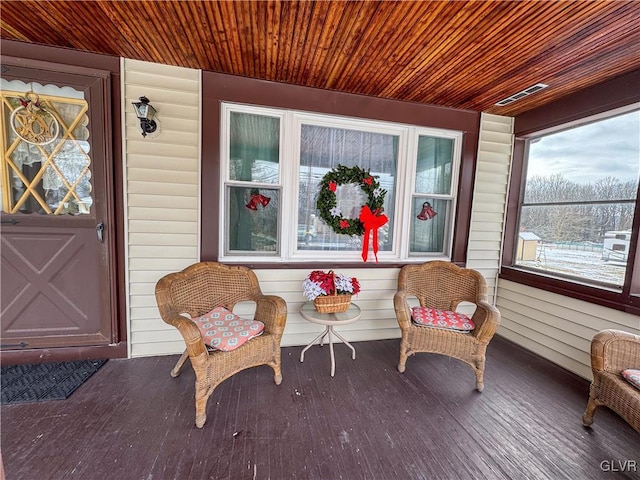 entrance to property featuring covered porch