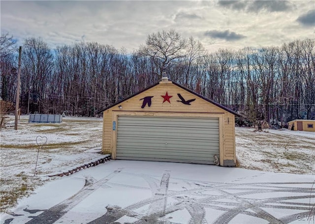 view of snow covered garage