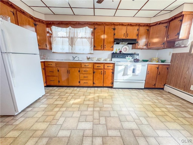 kitchen with a paneled ceiling, sink, and white appliances