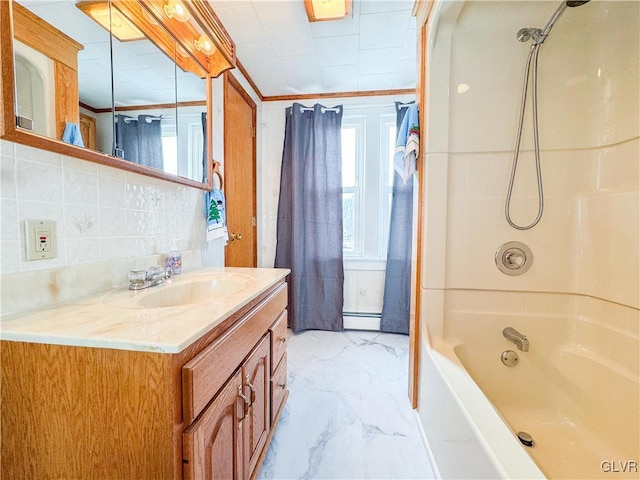 bathroom featuring tasteful backsplash, baseboard heating, ornamental molding, tub / shower combination, and vanity