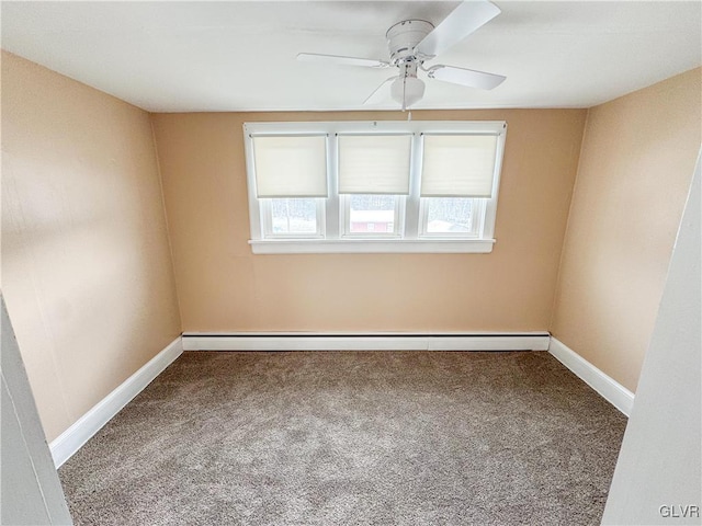 spare room with a baseboard heating unit, ceiling fan, carpet, and a healthy amount of sunlight